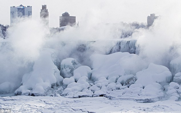 Masses of ice form in the lower Niagara River and around the American Falls as seen from Niagara Falls in Canada on Thursday